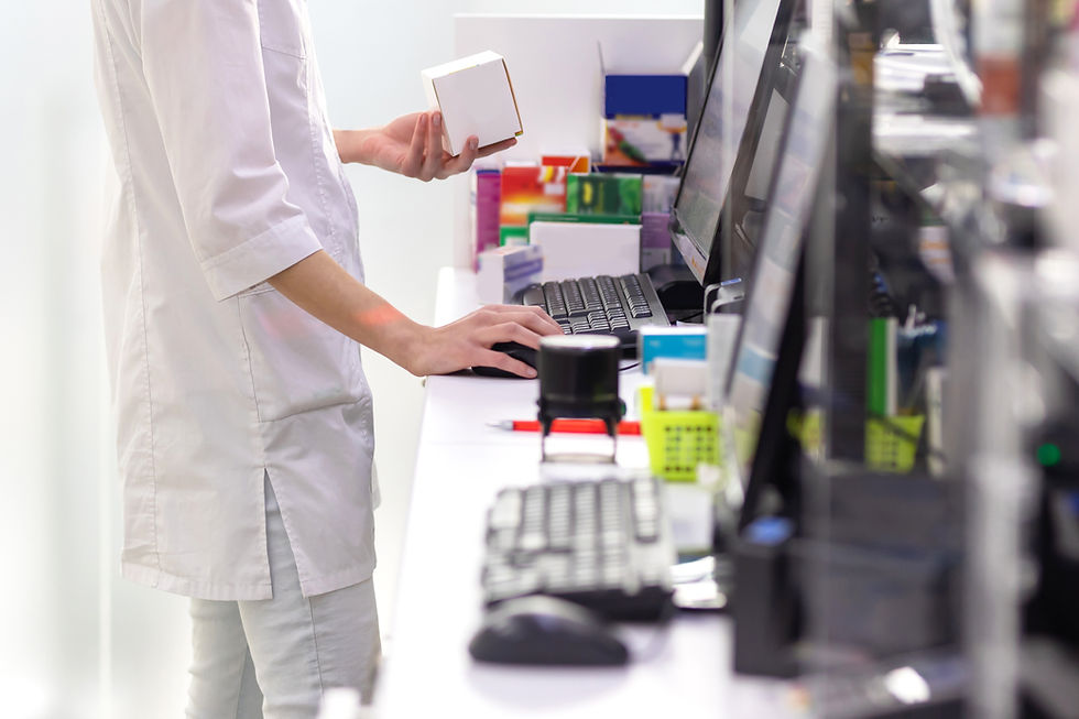 Pharmacist checking out a prescription